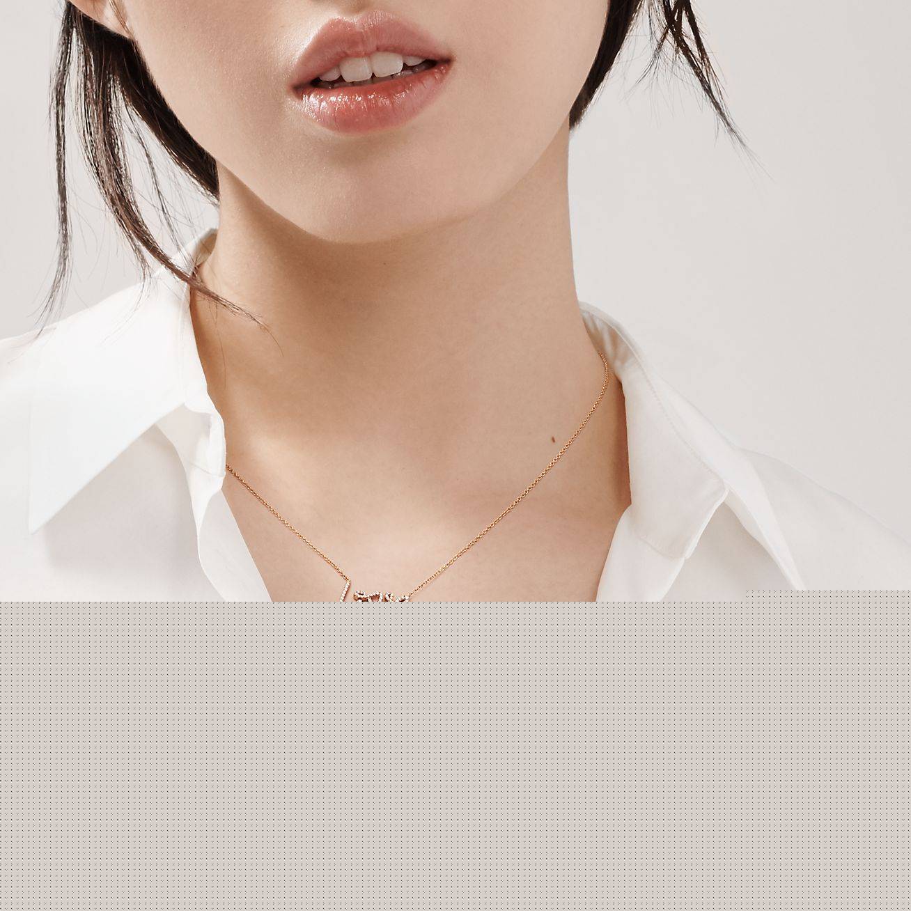 T*f*ny  palomas graffiti love pendant