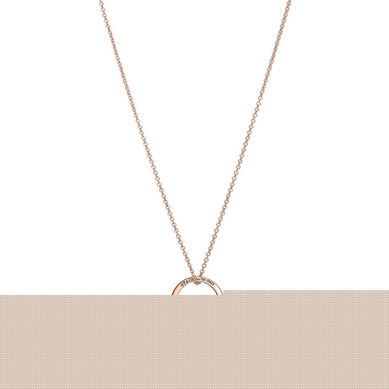 T*f*ny t pendant in 18k rose gold with a baguette diamond